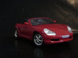 Porsche Boxster Cabriolet 1998 de couleur rouge, int�rieur noir (Vue c�t� passager)